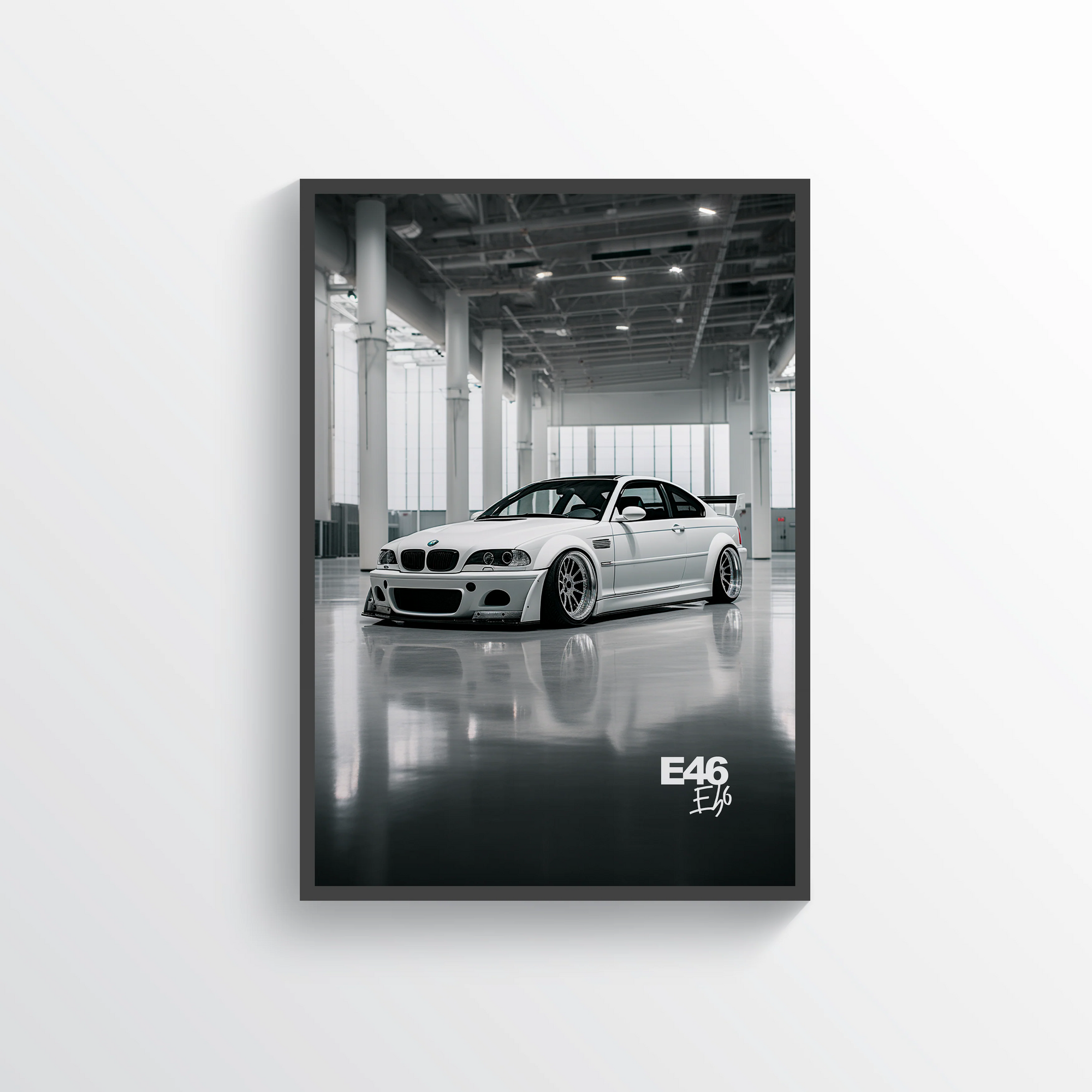 Framed poster of a white BMW M3 car in a garage with 'E46' text.